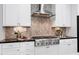 Open kitchen with stainless steel appliances and large island at 5904 Bellona Ln, Raleigh, NC 27612