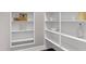 White built-in pantry with shelving for storage at 5904 Bellona Ln, Raleigh, NC 27612