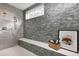 Spa-like shower with gray tile and built-in seat at 5904 Bellona Ln, Raleigh, NC 27612