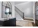 Elegant staircase with dark wood and metal railing at 5904 Bellona Ln, Raleigh, NC 27612