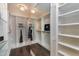 Large walk-in closet with mirrored doors and shelves at 5904 Bellona Ln, Raleigh, NC 27612