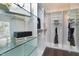 Bright walk-in closet with glass shelves and hanging space at 5904 Bellona Ln, Raleigh, NC 27612