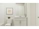 Clean bathroom with single vanity and white cabinets at 605 Morning Light Dr, Angier, NC 27501