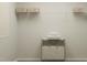 Neat laundry room with shelving and a laundry hamper at 605 Morning Light Dr, Angier, NC 27501