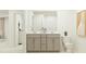 Double vanity bathroom with a toilet and a large mirror at 609 Morning Light Dr, Angier, NC 27501