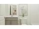 Simple bathroom with toilet, vanity, and mirror at 609 Morning Light Dr, Angier, NC 27501