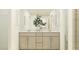 Double vanity bathroom with a large mirror at 609 Morning Light Dr, Angier, NC 27501