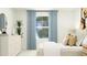 Bedroom featuring a bed, dresser, and blue curtains at 609 Morning Light Dr, Angier, NC 27501