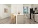 Modern kitchen with light gray cabinets and an island at 609 Morning Light Dr, Angier, NC 27501