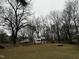 Large backyard with trees, recreational items, and ample space at 6908 Park Pl, Raleigh, NC 27616