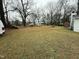 Spacious backyard with various items and a large open area at 6908 Park Pl, Raleigh, NC 27616