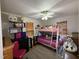 Bedroom with bunk bed, ceiling fan, and lots of toys at 6908 Park Pl, Raleigh, NC 27616