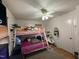 Bedroom with bunk bed, ceiling fan, and lots of toys at 6908 Park Pl, Raleigh, NC 27616