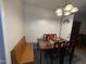 Dining area with wood table, bench, and chairs at 6908 Park Pl, Raleigh, NC 27616