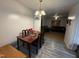 Dining room with hardwood floors, wooden table and four chairs at 6908 Park Pl, Raleigh, NC 27616