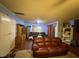 Living room with brown leather couches and built-in shelving at 6908 Park Pl, Raleigh, NC 27616