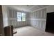 Unfinished bedroom showcasing a large window, natural light, and neutral wall color at 7934 Wexford Waters Ln, Wake Forest, NC 27587