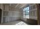 Bedroom during construction featuring a large window, allowing ample natural light at 7934 Wexford Waters Ln, Wake Forest, NC 27587
