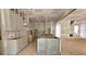 Kitchen under construction with light cabinetry, an open layout and views to the staircase at 7934 Wexford Waters Ln, Wake Forest, NC 27587