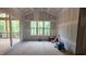 New home with a large window and sliding glass doors leading to outdoor deck space at 7934 Wexford Waters Ln, Wake Forest, NC 27587