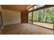 The screened porch features wood ceiling, railings, and ample space to enjoy the outdoors at 7934 Wexford Waters Ln, Wake Forest, NC 27587