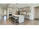 Bright, updated kitchen featuring an island, stainless steel appliances, and modern finishes at 90 Demascus Way # 024, Four Oaks, NC 27524