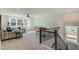 Bright living room with large windows, a modern ceiling fan, and a comfortable seating area at 90 Demascus Way # 024, Four Oaks, NC 27524
