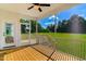 Relaxing screened porch with a wooden deck and scenic views of the expansive backyard at 90 Demascus Way # 024, Four Oaks, NC 27524