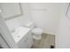 Neat bathroom with toilet, vanity, and wood-look floors at 915 Da Vinci St, Durham, NC 27704