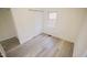 Spacious bedroom featuring wood-look floors and a window at 915 Da Vinci St, Durham, NC 27704