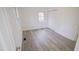 Bright bedroom with wood-look floors and double closets at 915 Da Vinci St, Durham, NC 27704
