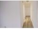 Hallway with light walls and wood-look floors at 915 Da Vinci St, Durham, NC 27704