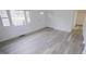 Living room featuring wood-look floors and large windows at 915 Da Vinci St, Durham, NC 27704