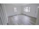 Bright living room with wood-look floors and neutral walls at 915 Da Vinci St, Durham, NC 27704