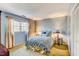 Light and airy bedroom with double windows and neutral decor at 10 Breton Pl, Durham, NC 27707