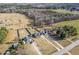 Wide aerial view showing multiple houses and surrounding farm land at 10080 Nc-39, Middlesex, NC 27557