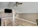 Large bonus room featuring a mounted TV and hardwood floors at 10080 Nc-39, Middlesex, NC 27557