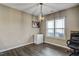 Bright dining area with hardwood floors and a modern chandelier at 10080 Nc-39, Middlesex, NC 27557