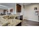 Kitchen with granite countertops and dark wood cabinets at 10080 Nc-39, Middlesex, NC 27557