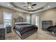 Spacious main bedroom with plush bed and ceiling fan at 10080 Nc-39, Middlesex, NC 27557