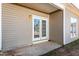 French doors open to a small back patio area at 105 Danesway Dr, Holly Springs, NC 27540