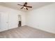 Bedroom with ceiling fan and bathroom access at 105 Danesway Dr, Holly Springs, NC 27540