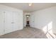 Bedroom with double door closet and access to bathroom at 105 Danesway Dr, Holly Springs, NC 27540