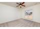 Bright bedroom with ceiling fan and large window at 105 Danesway Dr, Holly Springs, NC 27540