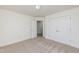 Bedroom with double door closet and carpet floor at 105 Danesway Dr, Holly Springs, NC 27540
