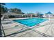 Community swimming pool with adjacent clubhouse and playground at 105 Danesway Dr, Holly Springs, NC 27540
