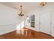 Formal dining room with hardwood floors and chandelier at 105 Danesway Dr, Holly Springs, NC 27540