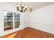 Dining room with hardwood floors and chandelier at 105 Danesway Dr, Holly Springs, NC 27540