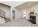 Living room with fireplace, access to patio and stairs at 105 Danesway Dr, Holly Springs, NC 27540