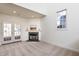 Spacious living room with fireplace and French doors at 105 Danesway Dr, Holly Springs, NC 27540
